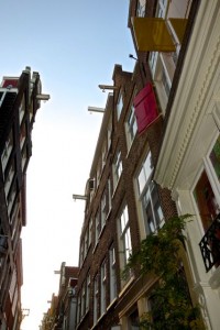 Narrow homes rely on top story pullies for large goods   